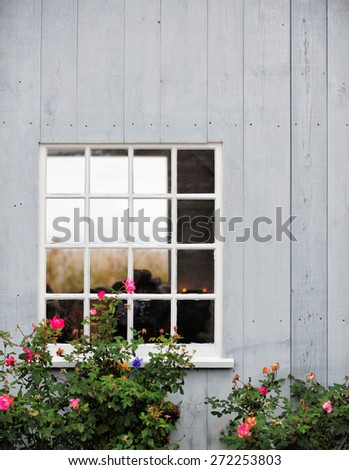an old wooden barn side with window