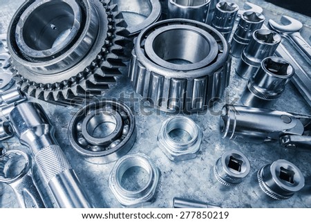 Car engine parts on metal background
