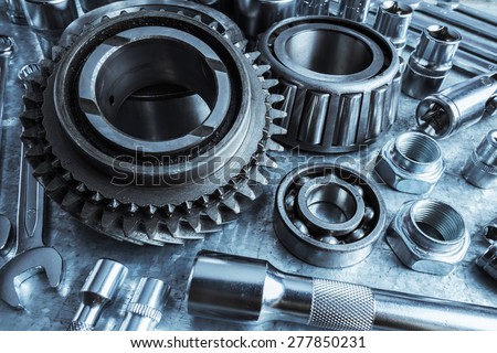 Car engine parts on metal background
