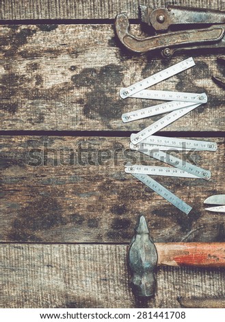 OLd tools on wooden background