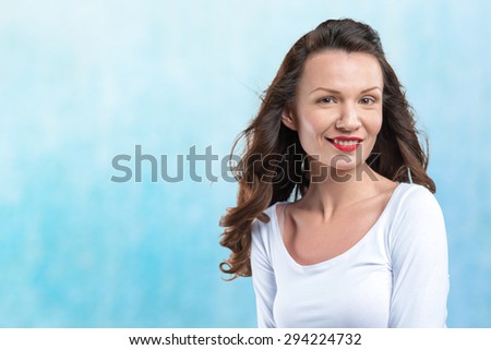 happy young woman on blue background