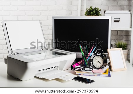 Working place of a business person. Computer, printer and other office supplies