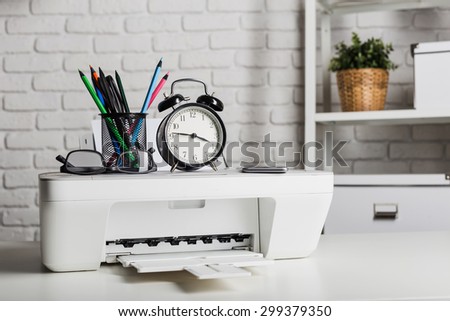 Working place of a business person. Printer, computer and other office supplies