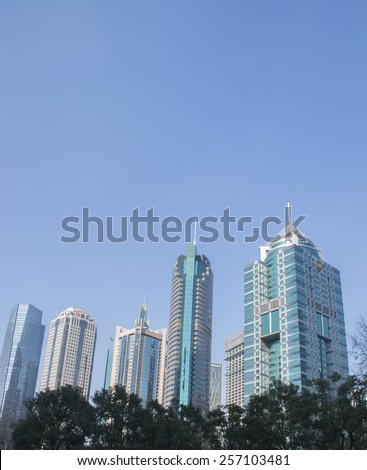 SHANGHAI-FEB. 9, 2015: Skyscrapers at Lujiazui, a national-level development zone designated by government. In 2005, State Council reaffirmed positioning of Lujiazui area as finance and trade zone.