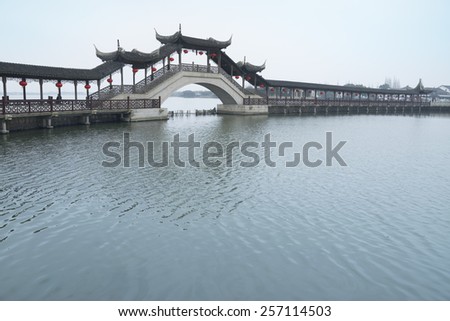 JINXI, SHANGHAI, CHINA - FEB 21, 2015: The antique Wenchang Pavilion to the old village at dusk. The village is a Shanghai tourist attraction with 100000 visitors year.