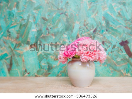 Pink Carnation fresh flowers in vase  on wood backgrounds