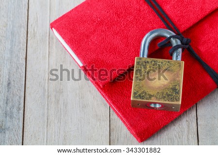 Red diary with a combination lock.