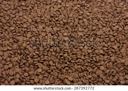 Dry pet food (dog or cat) brown background