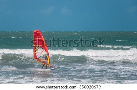 Jericoacoara, Ceara, Brazil - December 10, 2015 : Unidentified windsurfer riding on the waves in Atlantic ocean, documentary editorial.
