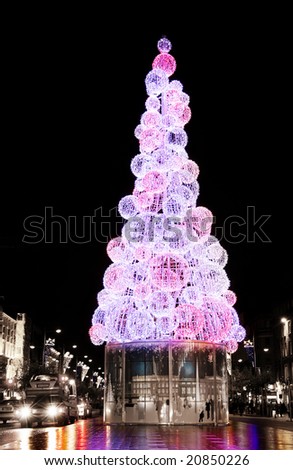Christmas tree on the streets of Dublin on a rainy winter night.