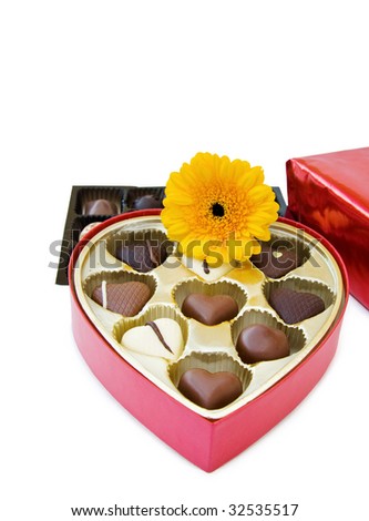 Heart shaped chocolates and flower for a special day\'s gift.