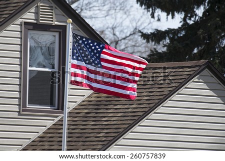 An American home displaying their flag.