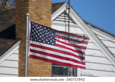 An American home displaying their flag.