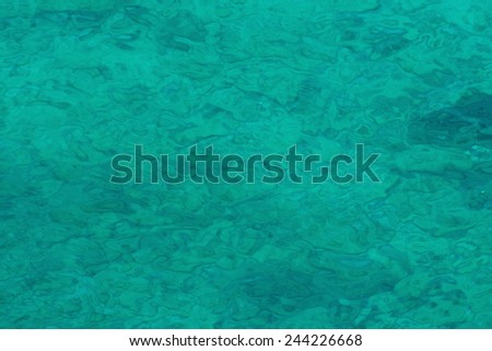 Sea surface green as emerald,Emerald-like green color of sea water surface,Just like an emerald green sea surface color.