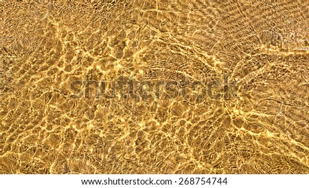 Shining ripples on the surface of water for nature background