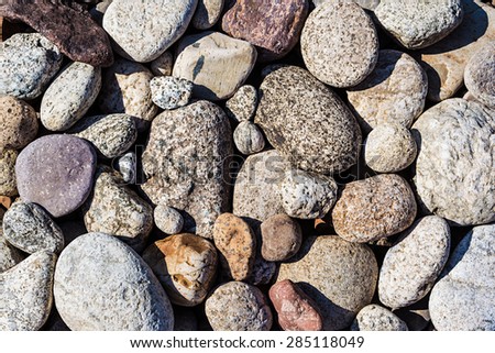 Colorful river pebble for natural background.