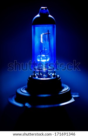 Xenon H7 car lamp equipment lamp light glass bulb on blue technological background