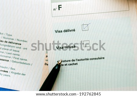 Visa approved marked with pen on french language application form