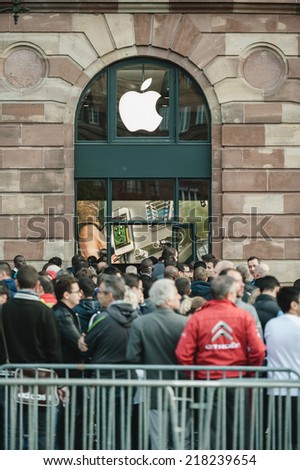 STRASBOURG, FRANCE - SEPTEMBER 19, 2014: Customers wait in line outside the Apple Inc. store during the sales launch of the iPhone 6 and iPhone 6 Plus worldwide, on Friday, Sept. 19, 2014