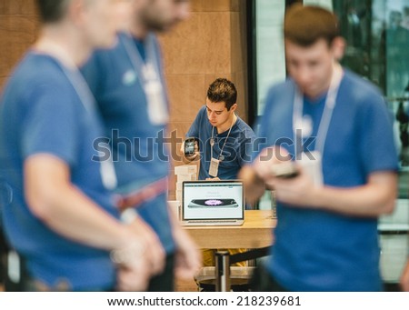 STRASBOURG, FRANCE - SEPTEMBER 19, 2014: A sales assistant scans new Apple iPhone 6 phones boxes at the Apple Store on the first day of sales of the new smart phone on September 19, 2014