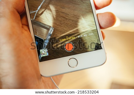 PARIS, FRANCE - SEPTEMBER 20, 2014: Hand holding a iPhone 6 Plus displaying the new Video Camera App with Time Lapse mode On during the sales launch of the latest Apple Inc