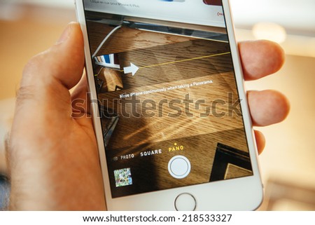 PARIS, FRANCE - SEPTEMBER 20, 2014: Hand holding a iPhone 6 Plus displaying the Camera app and Panorama Button during the sales launch of the latest Apple Inc. smartphones at the Apple store