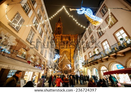 STRASBOURG, FRANCE - DEC 5, 2014: Notre-Dame de Strasbourg Cathedral main street square decorated for Christmas. Strasbourg is considered the most picturesque experience of Christmas spirit