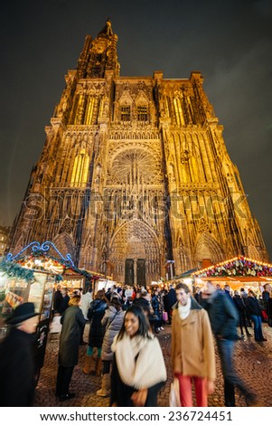STRASBOURG, FRANCE - DEC 5, 2014: Place de la Cathedrale during Christmas Market in Strasbourg. Strasbourg is considered the most picturesque experience of Christmas spirit