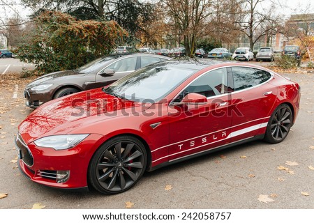 PARIS, FRANCE - NOVEMBER 29, 2014: Row of New Tesla Model S cars in front of showroom in Paris, France. Tesla is an American company that designs, manufactures, and sells electric cars