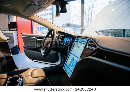 PARIS, FRANCE - NOVEMBER 29, 2014: The interior of a Tesla Motors Inc. Model S electric vehicle with its large touchscreen dashboard.