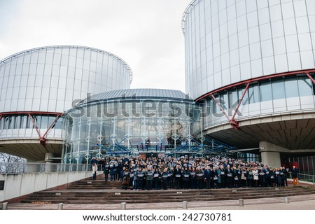 STRASBOURG, FRANCE - 8 JAN 2015: European Court of Human Rights President Dean Spielmann and Registrar Erik Fribergh, judges and jurists observe a minute of silence for Charlie Hebdo
