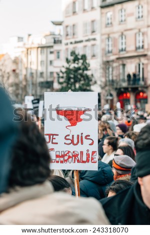 STRASBOURG, FRANCE - 11 JAN, 2015: People hold placards reading \'Je suis Charlie\' during a unity rally (Marche Republicaine) where some 50000 took part in tribute three-day killing spree in Paris