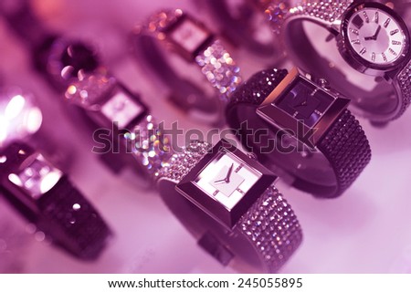 Luxury watches on display in a jewelry store - LED violet color cast to give extra luxury feel.