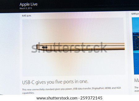 PARIS, FRANCE - MAR 9, 2015: Apple Computers event keynote tweets close up seen on iMac with the newly launched MacBook featuring new connectivity USB-C givving five ports in one