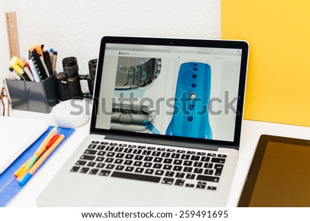 PARIS, FRANCE - MAR 10, 2015: Apple Computers website on MacBook Retina in room environment showcasing newly launched Apple Watch section on site as seen on 10 March, 2015