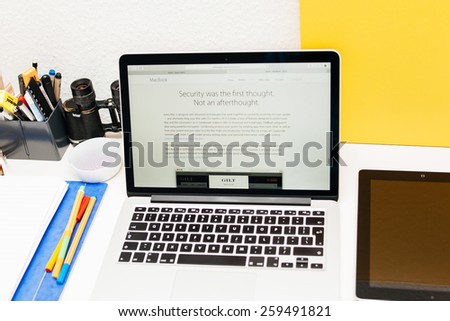 PARIS, FRANCE - MAR 10, 2015: Apple Computers website on MacBook Retina in room environment showcasing new MacBook and its security protocols as seen on 10 March, 2015