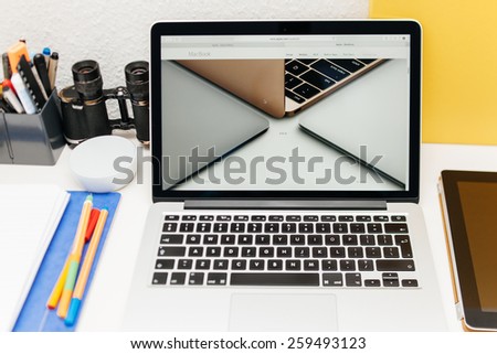 PARIS, FRANCE - MAR 10, 2015: Apple Computers website on MacBook Retina in room environment showcasing three versions of newly launched MacBook Space Gray, Gold and Silver