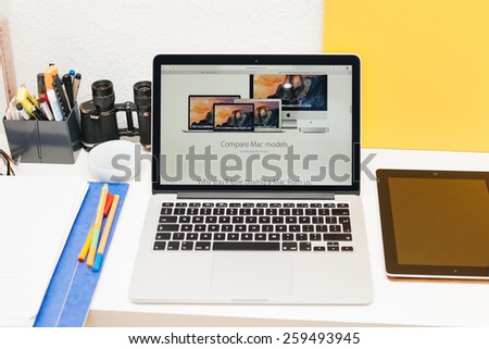 PARIS, FRANCE - MAR 10, 2015: Apple Computers website on MacBook Retina in room environment showcasing comparation between Mac models as seen on 10 March, 2015