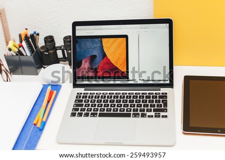 PARIS, FRANCE - MAR 10, 2015: Apple Computers website on MacBook Retina in room environment showcasing MacBook thin specs as seen on 10 March, 2015 with a tilt-shift lens