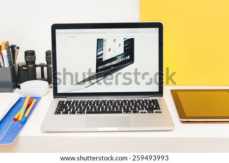 PARIS, FRANCE - MAR 10, 2015: Apple Computers website on MacBook Retina in room environment showcasing New MacBook as seen on 10 March, 2015