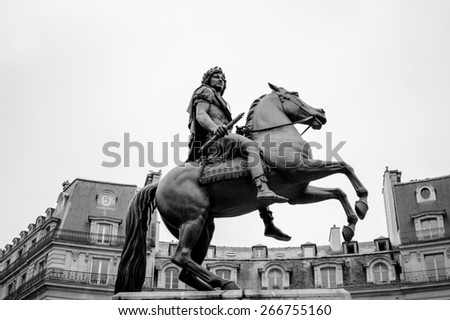 PARIS, FRANCE - JANUARY 23, 2013: Place des Victoires in Paris with the equestrian monument in honor of King Louis XIV, celebrating the Treaties of Nijmegen concluded in 1678-79
