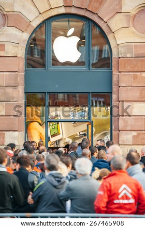 STRASBOURG, FRANCE - SEPTEMBER 19, 2014: Customers wait in line outside the Apple Inc. store during the sales launch of the iPhone 6 and iPhone 6 Plus in Europe, on Friday, Sept. 19, 2014