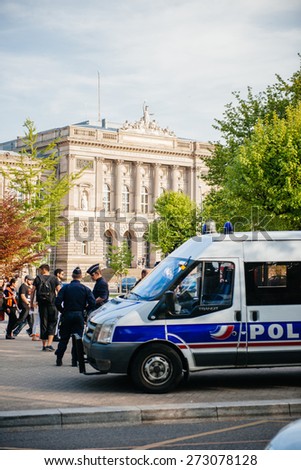STRASBOURG, FRANCE - APRIL 24, 2015: Police surveillance over armenian protesters march for 100th remembrance year of Armenian genocide in 1915 as part of \'Armenian Genocide Remembrance Day\'