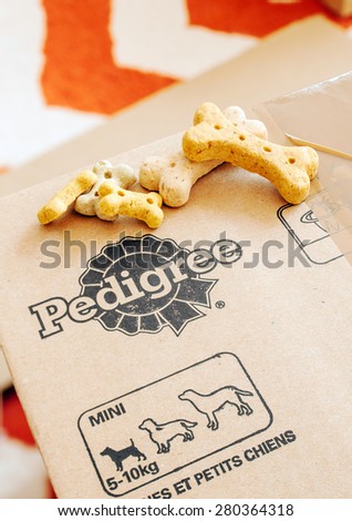 FRANKFURT, GERMANY - SEPTEMBER 20, 2014: Box of Pedigree Petfoods with dog food on top. Pedigree is a subsidiary of the American group Mars specializing in pet food, with factories in England