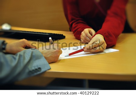 Businessman signing contract with bank clerk help