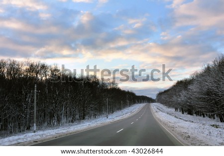 Winter view of Highway 72 along forest in eastern France. Useful file for your book, brochure and flyer about transportation conditions in Europe.