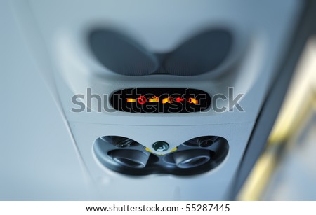 stock photo : No Smoking and Fasten Seat belt Sign Inside an Airplane.