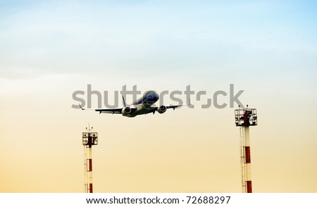 Low angle view of airplane landing process. Beautiful photograph for your brochure about safety, transportation or travel.