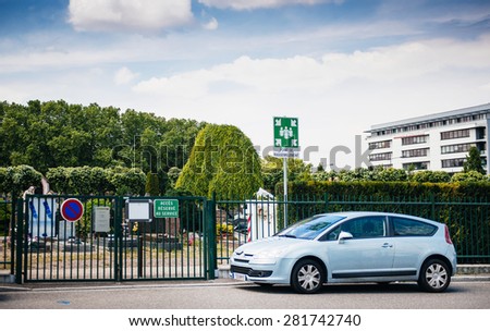 STRASBOURG, FRANCE - MAY 23, 2015: French car parked in front of Meeting Point sing at the entrance to Neudorf cemetery - Cimetiere Municipal Saint Urbain - in Strasbourg, France