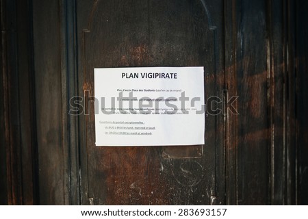 STRASBOURG, FRANCE - APRIL 18, 2015: Security measures instruction on a school door, during the country wide Plan Vigipirate after the Charlie Hebdo shooting.